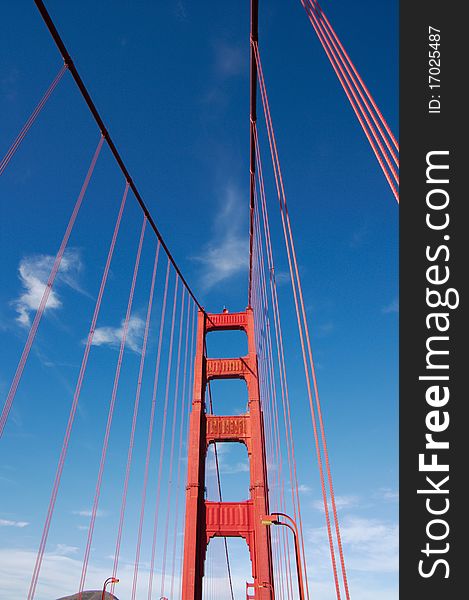 Fragment view on Golden Gate bridge in daylight, vertical. San-Francisco, California, USA. Fragment view on Golden Gate bridge in daylight, vertical. San-Francisco, California, USA