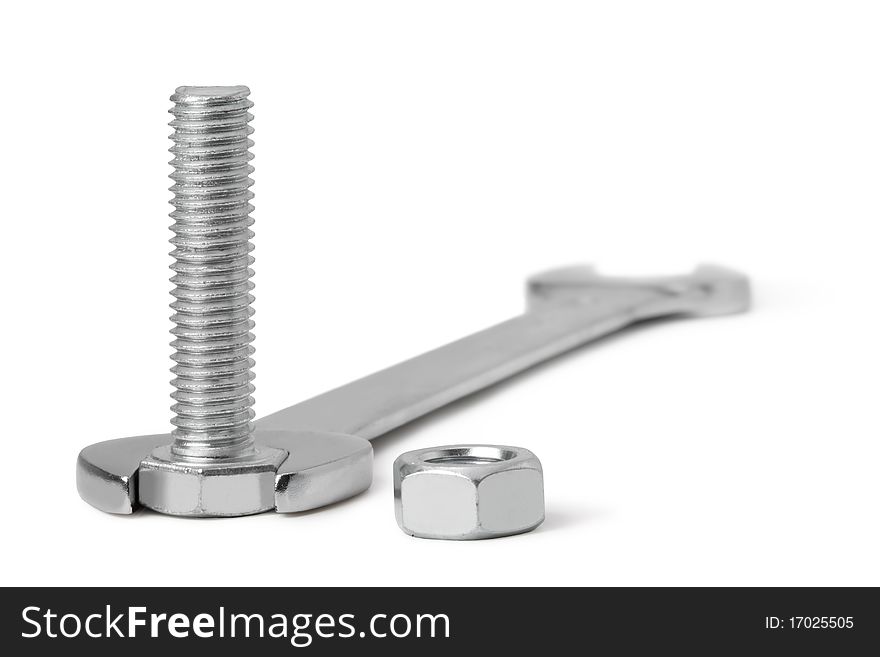 Chrome spanner, nuts and bolts on a white background