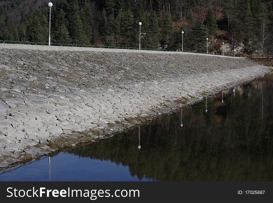 A dam's wall in a mountain