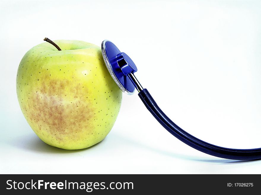 Green apple and stethoscope