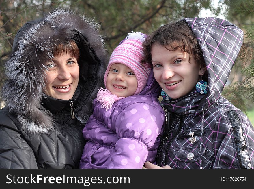 Young mother with two daughters outdoor