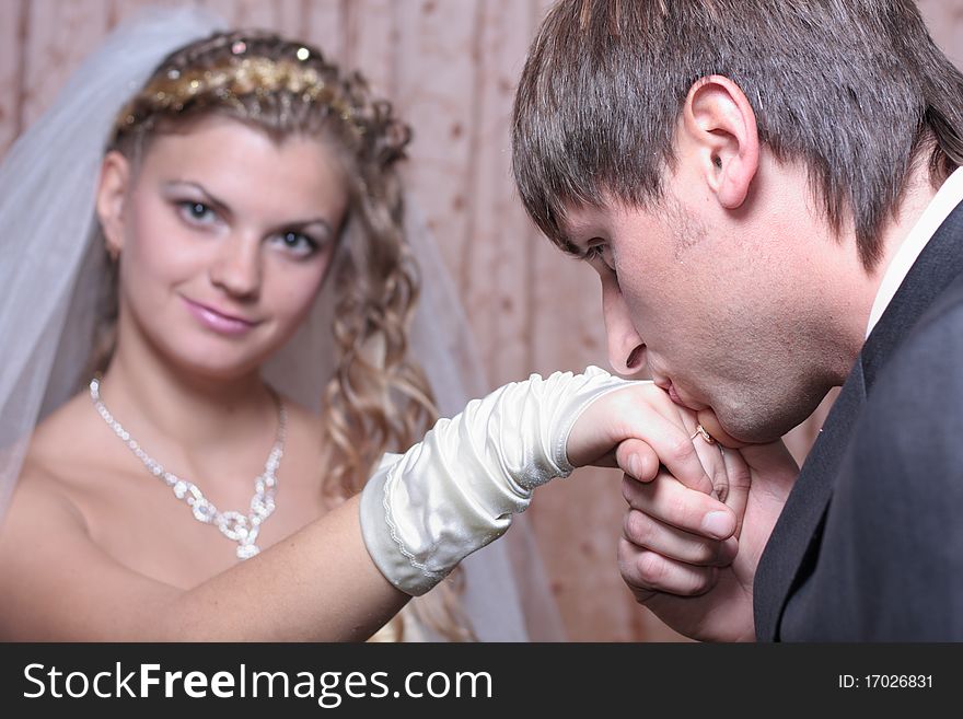 Groom Kissing Hand Of Smiling Bride