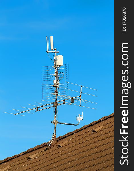 Television antenna and wi-fi transmitter on the roof. Television antenna and wi-fi transmitter on the roof