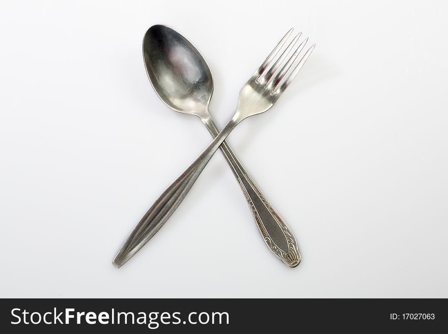 Silverware - fork оn a white background