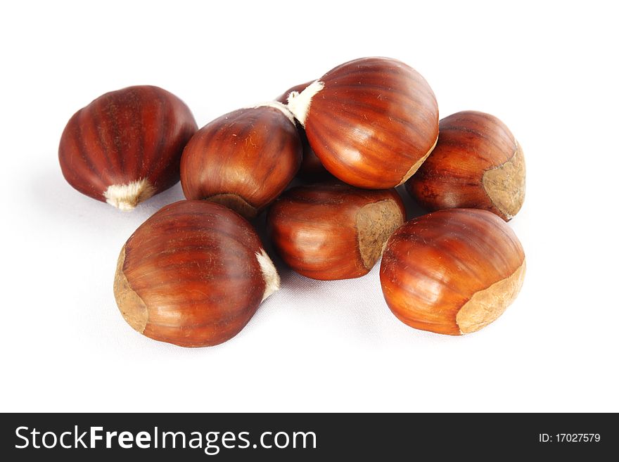 Chestnuts over a white background.