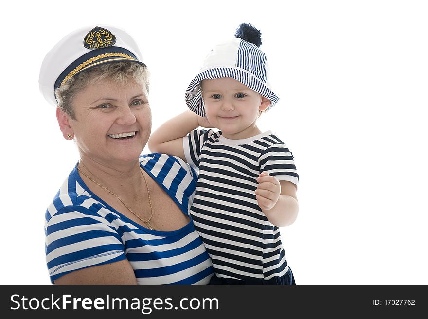 Woman in captain suit playing with baby in studio. Woman in captain suit playing with baby in studio