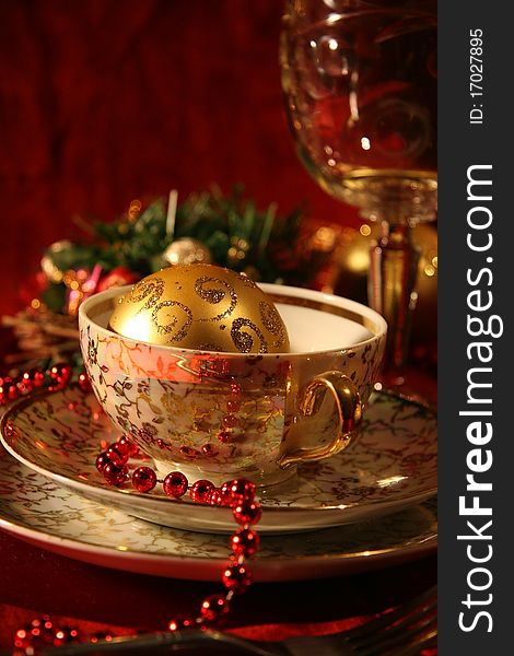 Table with gold dishes on red background. Table with gold dishes on red background