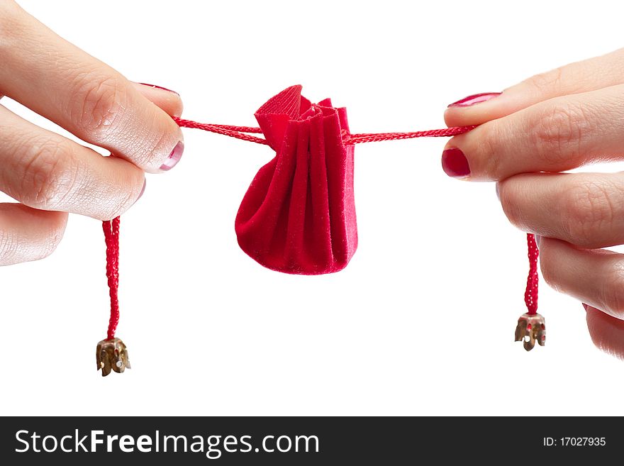 Woman stretching ribbons of gift wrapping