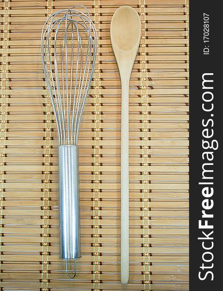 Cooking utensils on bamboo background
