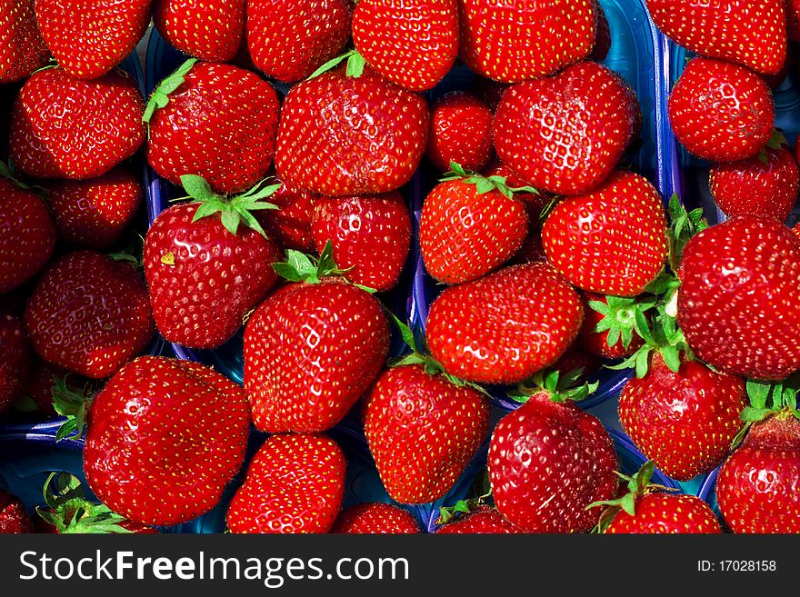 Landscape view of red strawberry background in the box in a market