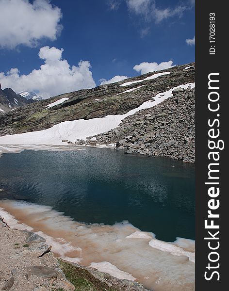 Lake and snow during the spring in Piemonte. Lake and snow during the spring in Piemonte
