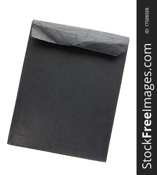 Old black envelope isolated on white
