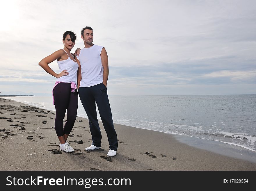 Happy Young Couple Have Fun At Beautiful Beach