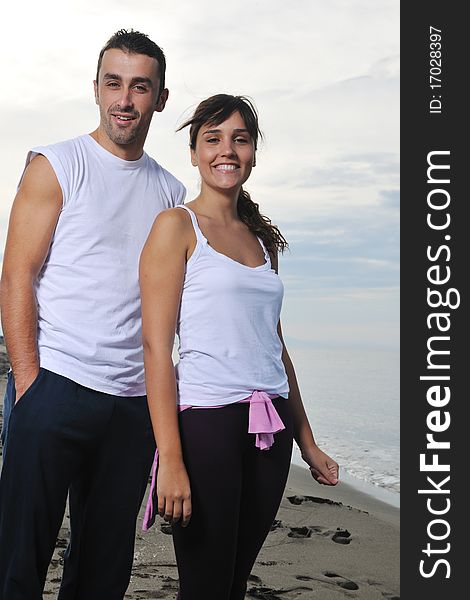 Happy young couple have fun at beautiful beach