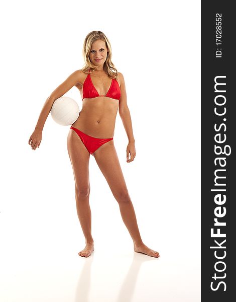 Portrait of young woman in red bikini holding volleyball. Portrait of young woman in red bikini holding volleyball