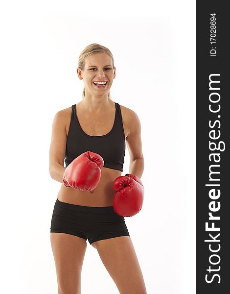 Young woman wearing red boxing gloves. Young woman wearing red boxing gloves