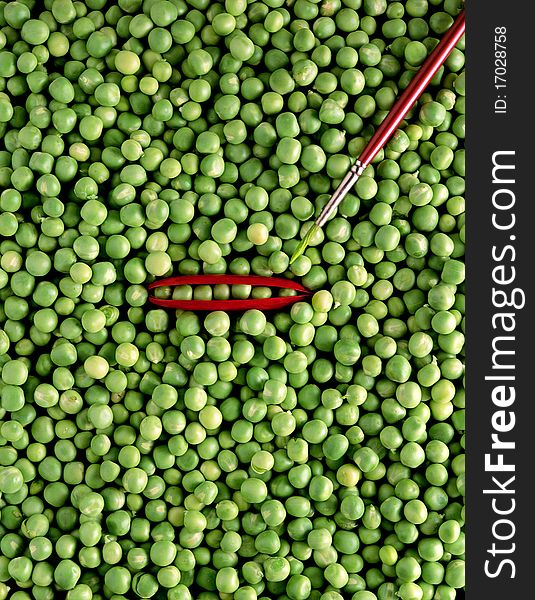 Green pea with a red pod and a paintbrush