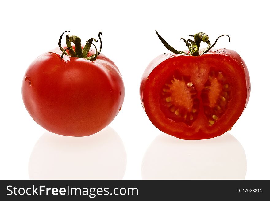 Fresh organic red tomatoes cuted one inn half. Fresh organic red tomatoes cuted one inn half.