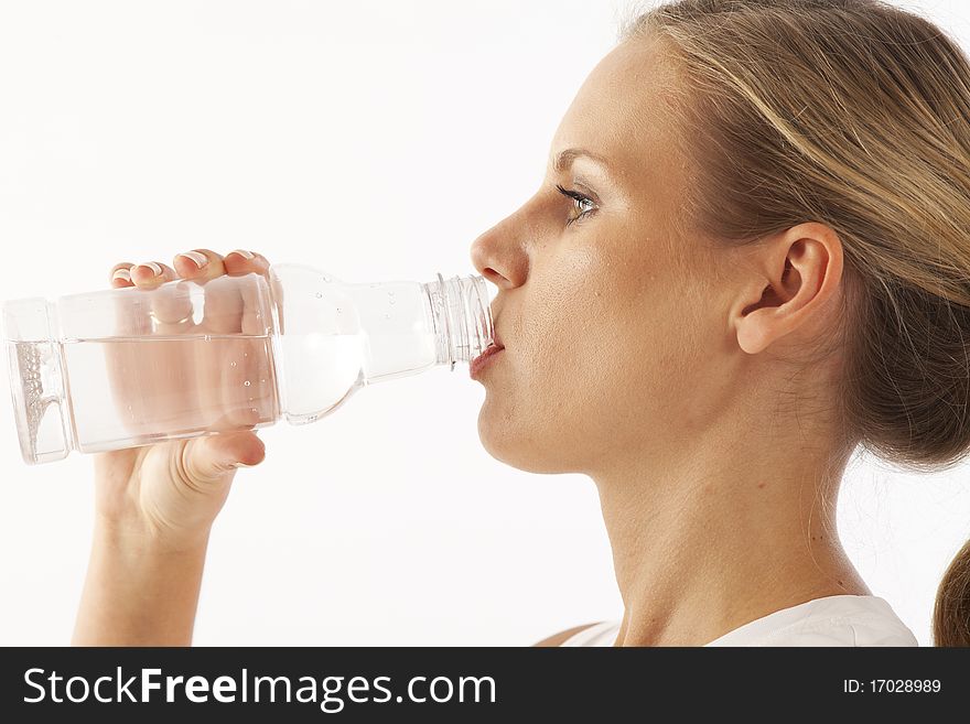 Young woman drinking bottled water