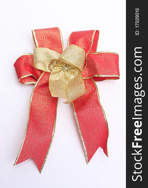 Red bow and paper on white background