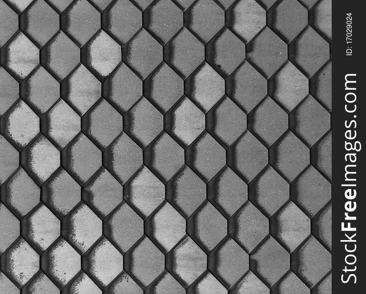 Hexagonal grey slate tiles set in a repeating pattern. Hexagonal grey slate tiles set in a repeating pattern