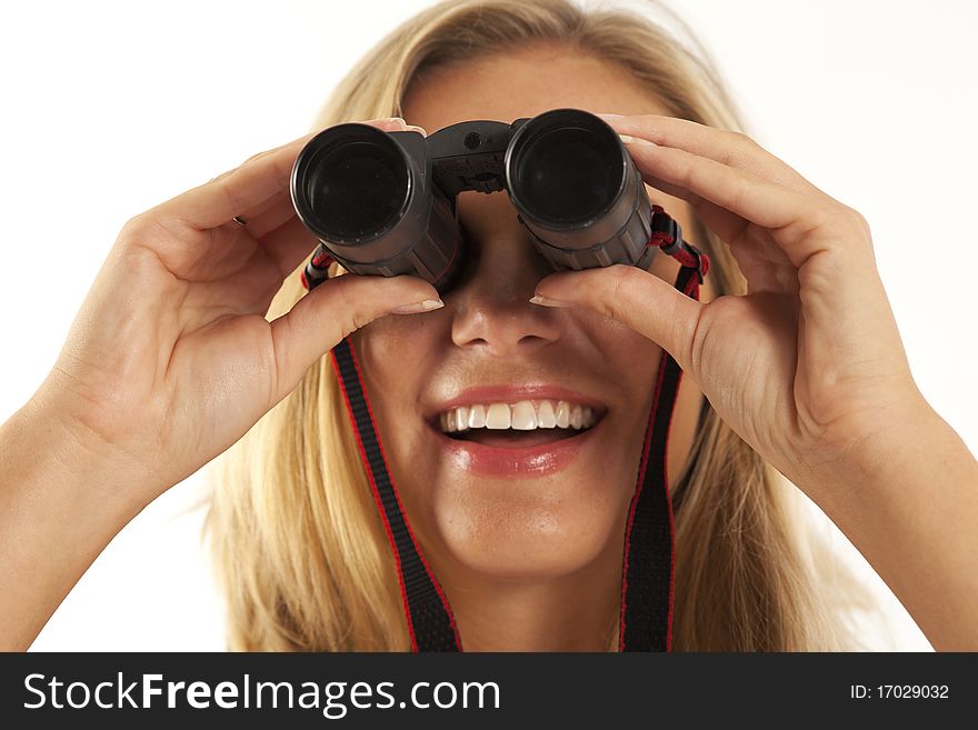 Close up of young woman looking through binoculars. Close up of young woman looking through binoculars