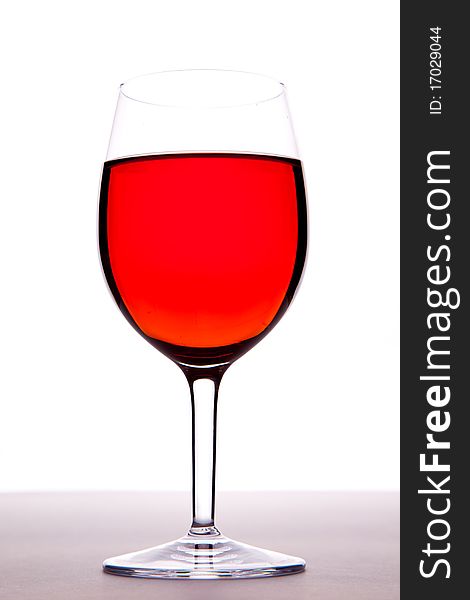 A glass of rose wine on a white background