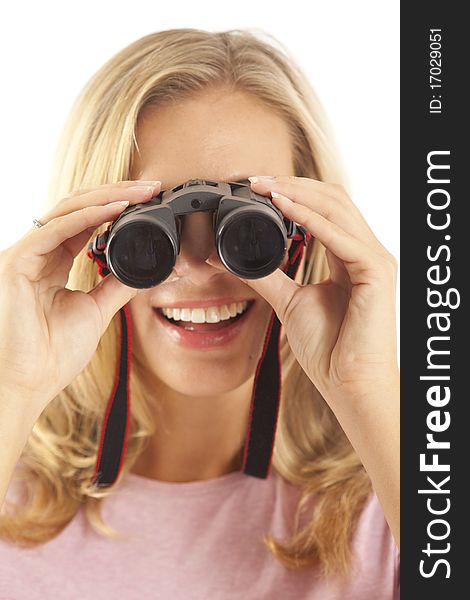 Close up of young woman looking through binoculars. Close up of young woman looking through binoculars