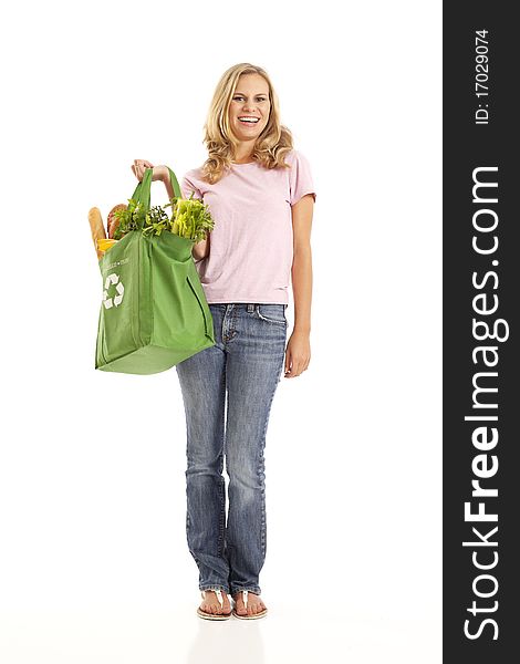 Young woman with groceries in recycle bag