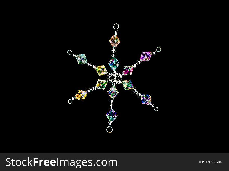 A crystal snowflake on a black background