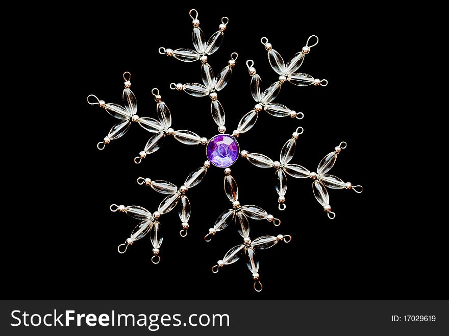 A crystal snowflake on a black background