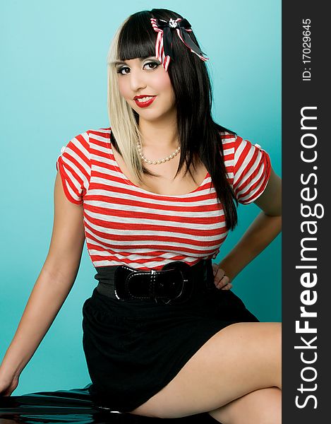 Asian girl wearing red and white striped shirt. Asian girl wearing red and white striped shirt