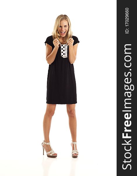 Young woman in black with small black and white shopping bag. Young woman in black with small black and white shopping bag