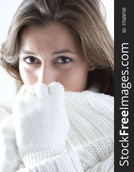 Portrait of a young woman in sof white sweater. Portrait of a young woman in sof white sweater