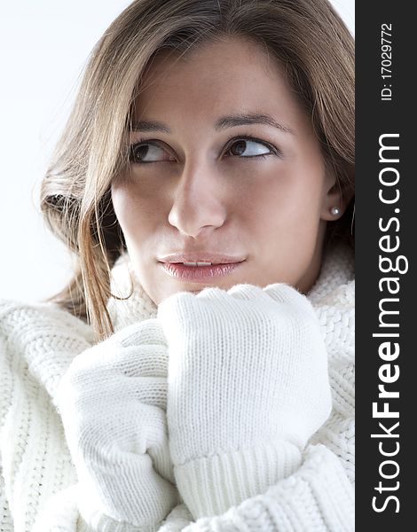Portrait of a young woman in sof white sweater. Portrait of a young woman in sof white sweater