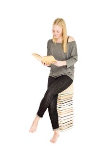 Young Girl On A Pile Of Books Stock Photo Young Girl On A Pile Of Books Stock Photo