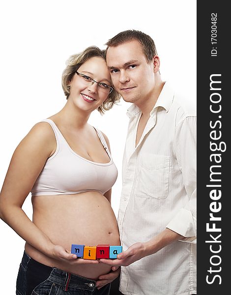 Happy smiling couple posing for pregnancy photographs. Happy smiling couple posing for pregnancy photographs