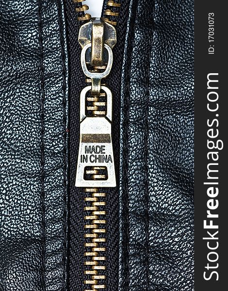 Metal zip and texture of artificial leather. Metal zip and texture of artificial leather