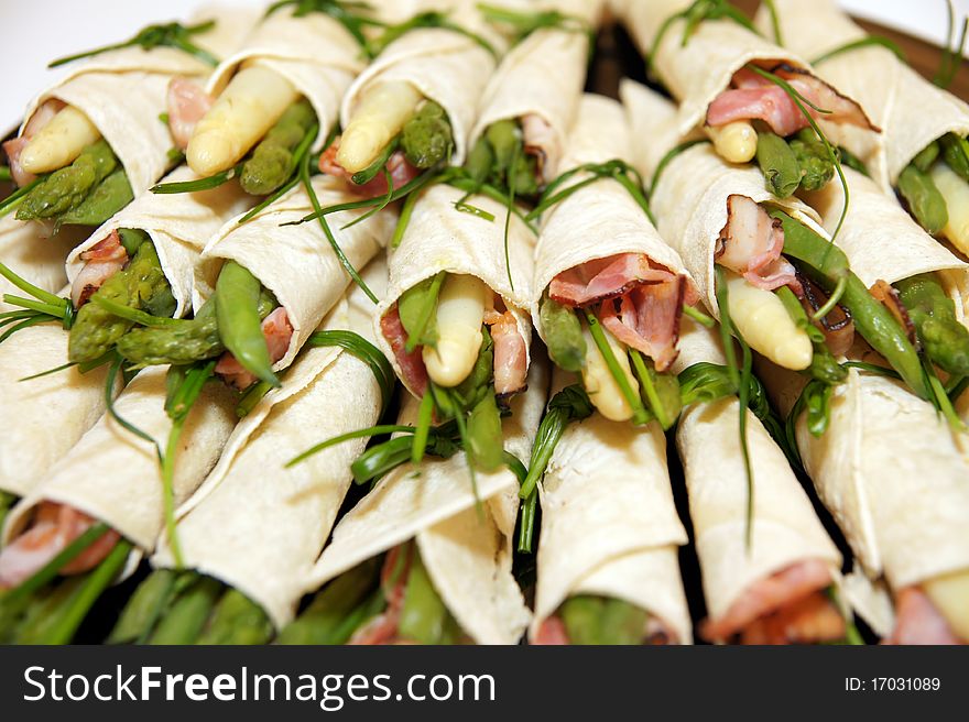 Detail on asparagus party rolls with ham. Detail on asparagus party rolls with ham