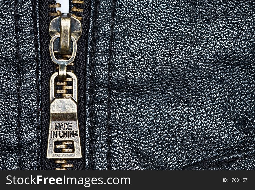 Metal zip and texture of artificial leather. Metal zip and texture of artificial leather