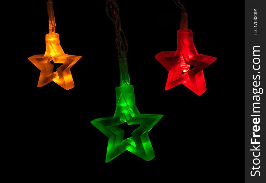 Christmas tree lights isolated against a black background