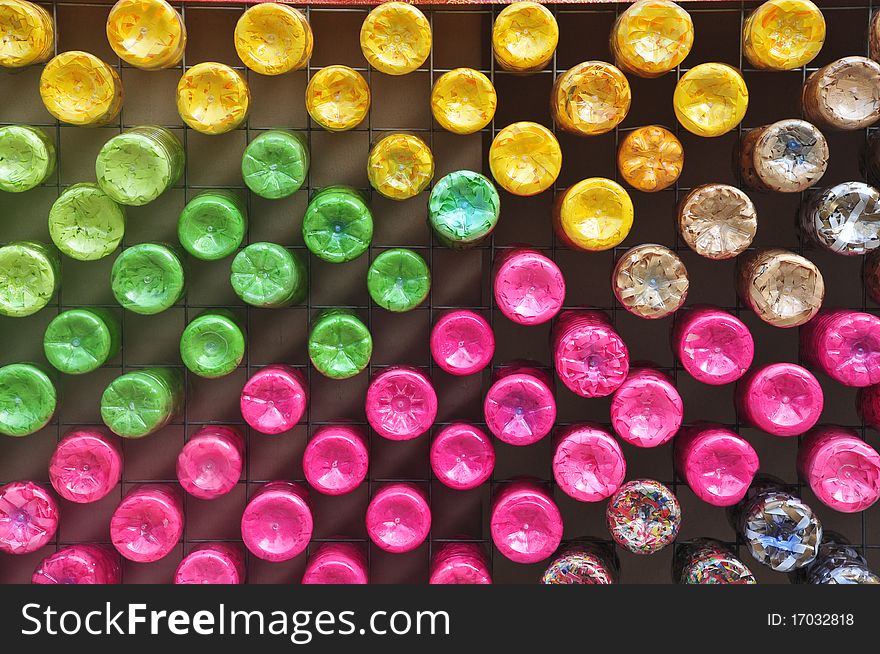 Colorful plastic bottle on the wall