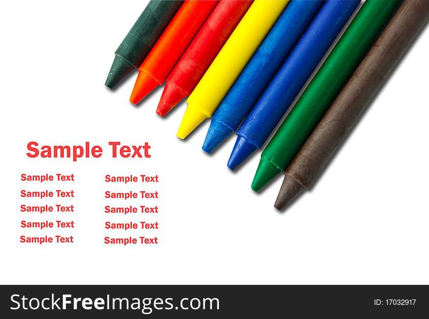 Colorful crayons on white with sample text