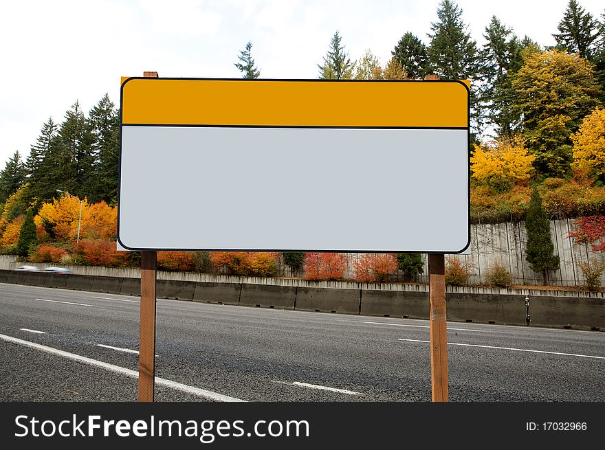 Blank construction sign outdoor day time fall season asphalt highway on background