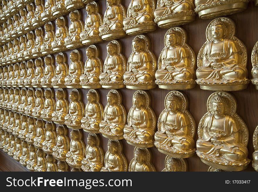 Buddha statue on the wall in Chinese Temple