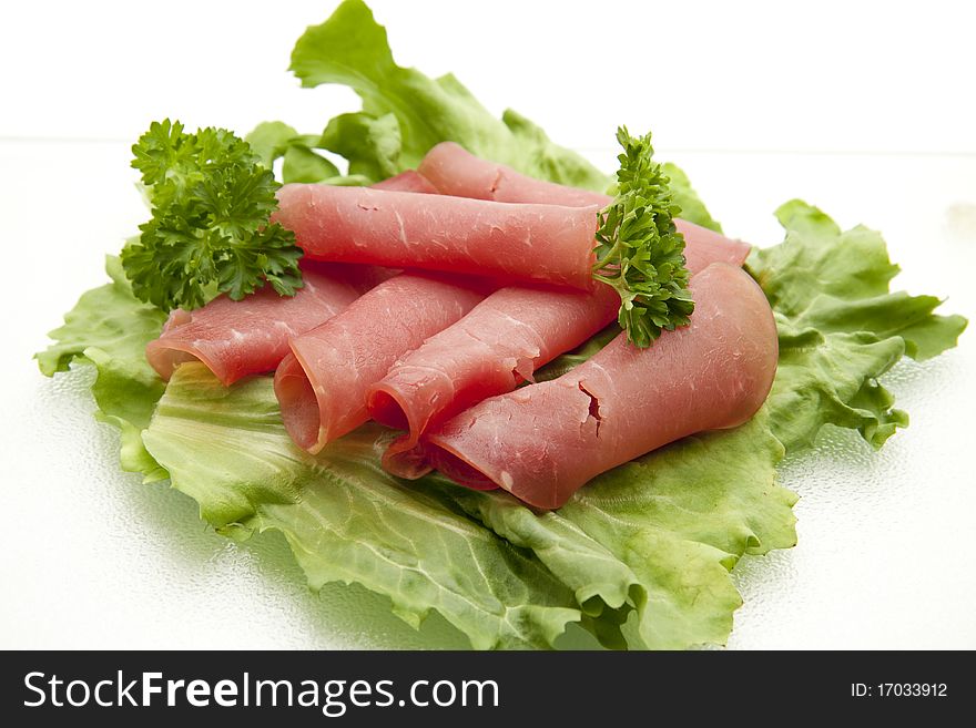 Laughing-ham onto lettuce leaves and with parsley. Laughing-ham onto lettuce leaves and with parsley