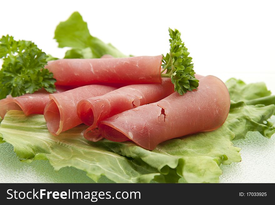 Nut ham onto lettuce leaves and with parsley