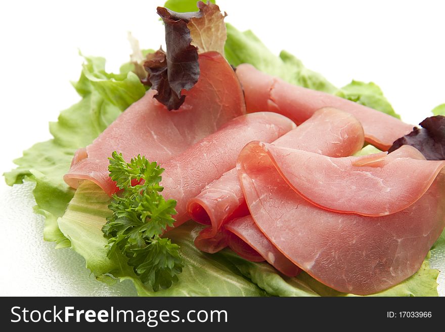 Nut ham onto lettuce leaves and with parsley