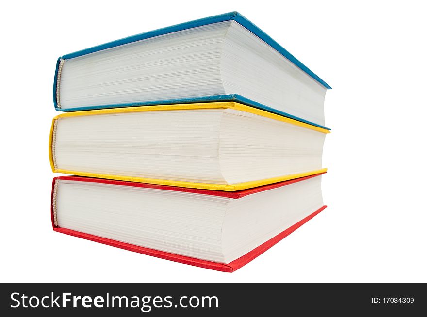 Horizontal stack of three books isolated on white background.wide angle. Horizontal stack of three books isolated on white background.wide angle.