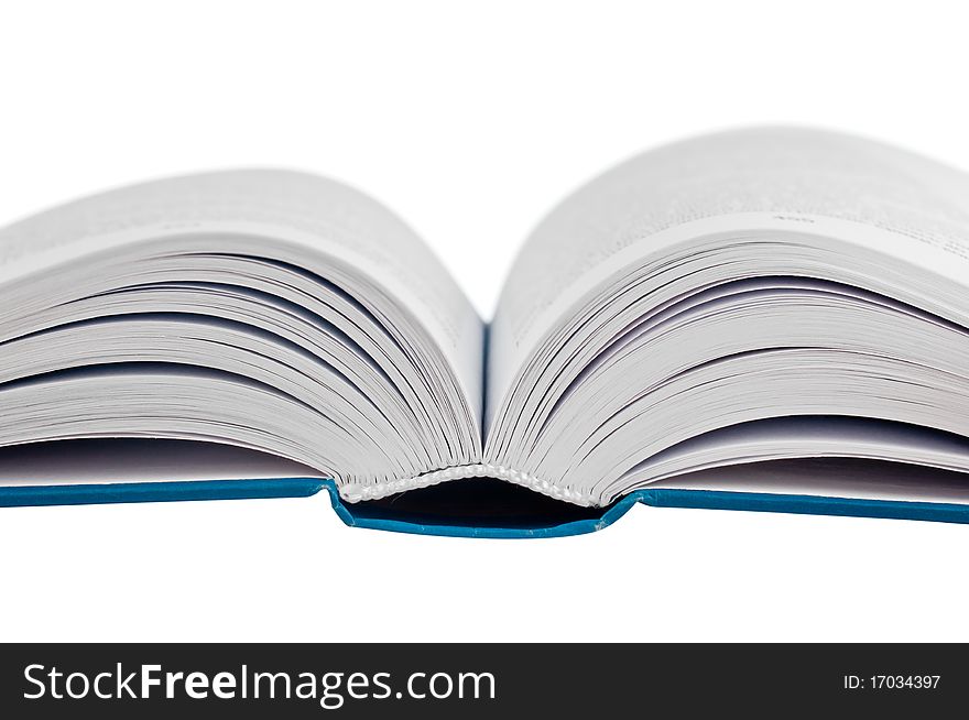 Closeup shot of opened book isolated on white background. macro.